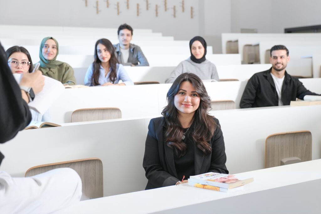 Students listening attentively in a bright university lecture hall. Student Visa